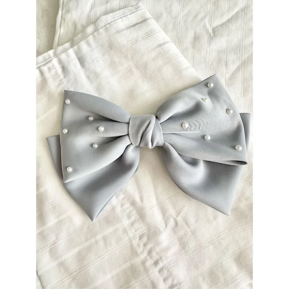 Light grey bow with delicate pearl embellishment